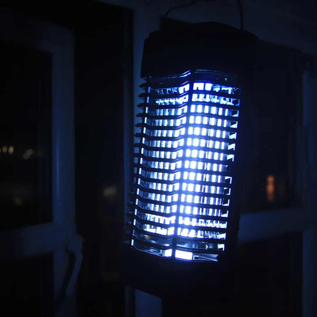 A picture of a Senelux Electric Bug Zapper hanging in front of a home window